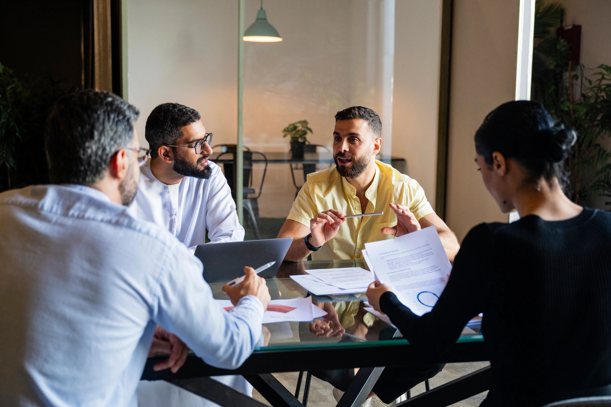 Business team reviewing documents together in a meeting